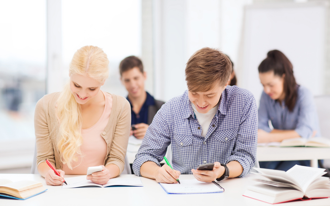 Students Looking into Smartphone at School